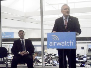 AirWatch chairman Alan Dabbiere, at left, listens as Gov. Nathan Deal praises the high-tech company's expansion.
