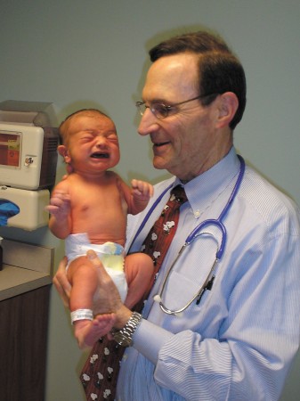 Dr. Jules Sherwinter holds newborn patient Chad Heacox during the boy’s first appointment at Dunwoody Pediatrics.