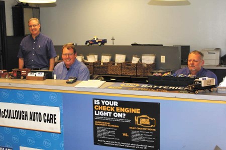 From left, three brothers, Eric, Rod and Brian McCullough, run the car shop McCullough AutoCare, continuing their father’s legacy.