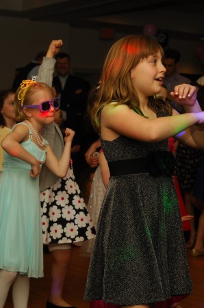  Emma Fountaine, left, and Rachel Urbach dance up a storm March 23 during the Father-Daughter dance at the Marcus Jewish Community Center of Atlanta.