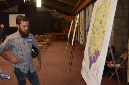 Joey Wilkinson examines a proposed plan for the North Buckhead neighborhood during a community meeting at  St. James United Methodist Church.