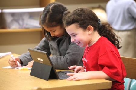 Lila Ross, left, and Sophie Carmel participate in the Hour of Code at The Epstein School in Sandy Springs.