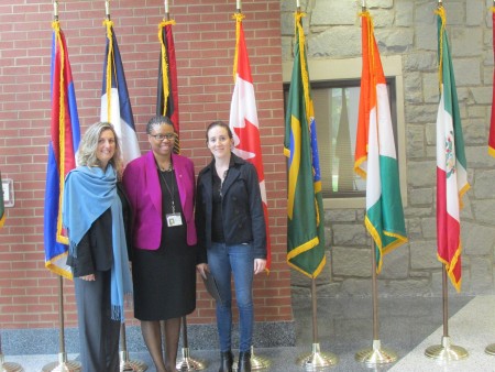 Dr. Shamita Johnson (center) poses with a principal and teacher from Sutton's sister school in France.