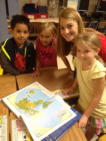 With the belief that it’s never too early to prepare for the real world, High Point Elementary hosted a former cartographer in its Career Connections Series. From left, first-graders Jesus Narciso Gallegos, Ally Stanfield and Hannah Tuttle look on as teacher Rebecca Negrin applies the information they learned about reading maps. 