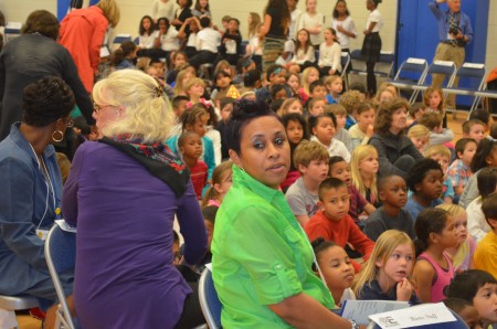 Kindergarten teachers Rachel Lightfoot, right, and Nancy Sears keep an eye on their students at the ribbon-cutting ceremony for the newly remodeled E. Rivers Elementary School. 