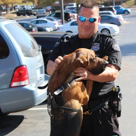 Sandy Springs K9 Seven and his handler, Officer Mike Stark, celebrate the donation of a protective vest for the K9.