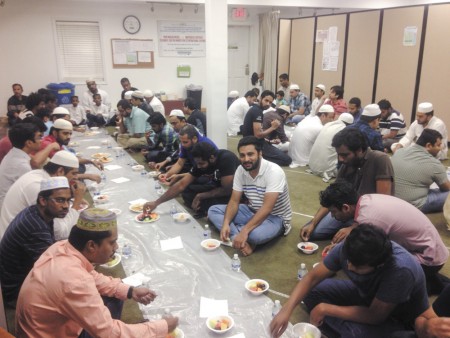 Men gather at Masjid Uthman in Dunwoody to celebrate Ramadan.