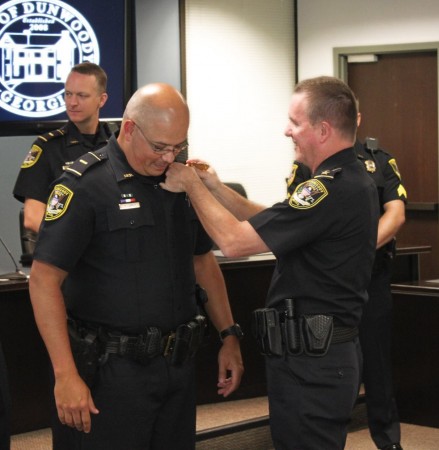 Sgt. Fidel Espinoza is promoted to rank of major by Chief Billy Grogan on Sept. 14. A total of 8 officers were promoted in the department. 