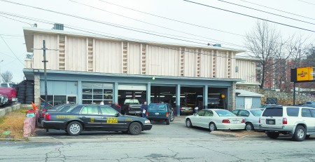 The former Eddie's Automotive, now Magic Mike's, at 260 Mount Vernon Highway, is considered historic by the state Historic Preservation Division. (Photo John Ruch)