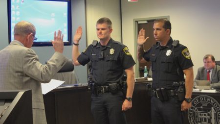 Mayor Denis Shortal swears in new Dunwoody Police officers Zach Woodburn (left) and Chris Valente. (Photo Dyana Bagby)
