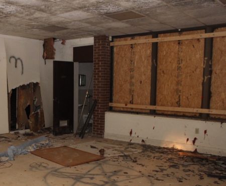 Graffiti and debris fill many of the former classrooms. (Photo Dyana Bagby)