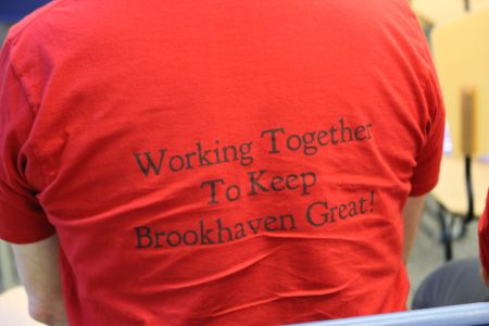 Dozens of homeowners opposed to the Solis Dresden development attended the July 26 City Council meeting wearing red shirts, several with these logos. (Photo Dyana Bagby)