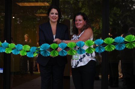 Jennifer Langley, BIA chair of the board, left, and Dr. Laurie Kimbrel, BIA head of school, cut the ribbon on the first day, Aug. 2. (Photo Phil Mosier)