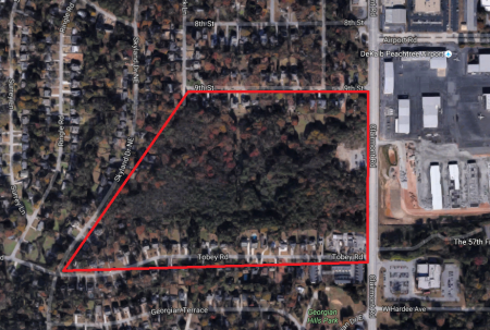 A Google Earth map showing the former DeKalb-Peachtree Airport land in red.