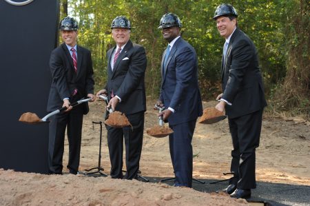 Tossing dirt for the ceremonial groundbreaking for the new Mercedes-Benz USA headquarters on Barfield Road are (from left) Dietmar Exler, MBUSA's president and CEO; Gov. Nathan Deal; Atlanta Mayor Kasim Reed; and Sandy Springs Mayor Rusty Paul. (Photo Phil Mosier)