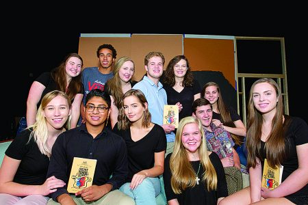 Riverwood International Charter School Theater members pose with the “Lend Me a Tenor” script. (James Barker Photography)