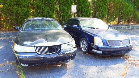 Damaged cars parked on Nov. 1 in the lot at the North Fulton Government Services rented by Classic Cadillac and Subaru. (Photo John Ruch)