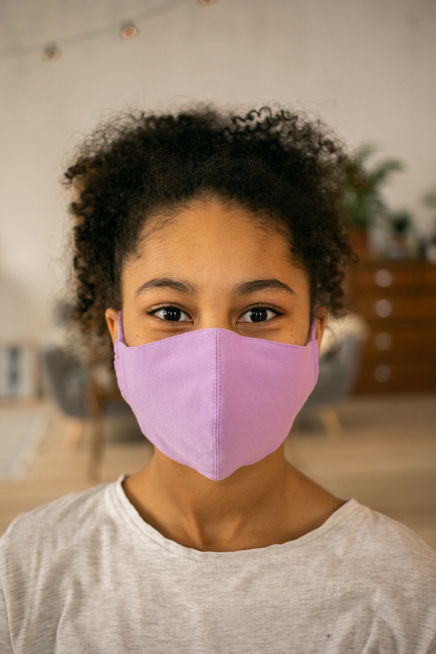 black girl in medical mask
