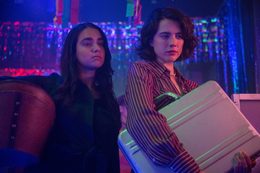 (Left to right) Geraldine Viswanathan as Marian and Margaret Qualley as Jamie in director Ethan Coen's "Drive-Away Dolls." (Credit: Wilson Webb / Working Title / Focus Features)