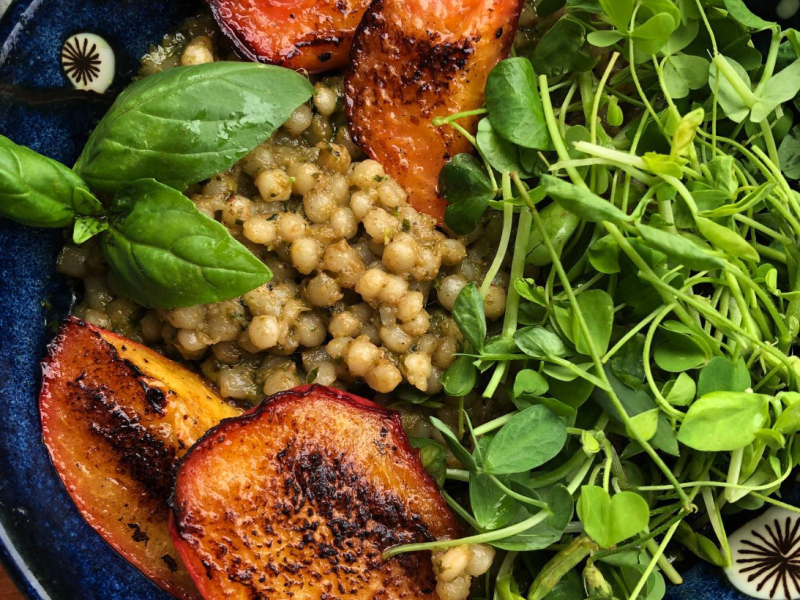 Microgreen Pesto with Israeli Cous Cous and Roasted Peaches from Community Farmers Markets (Photo courtesy CMF Instagram).