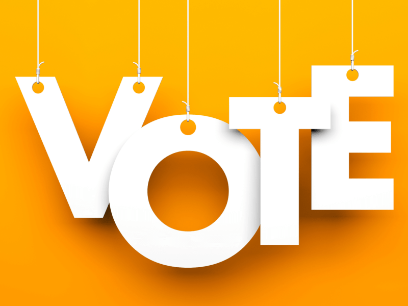 A yellow background with the word VOTE in all caps.